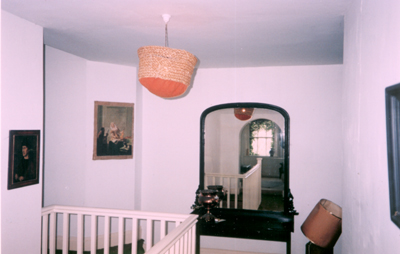 the landing,at the top of the stairs